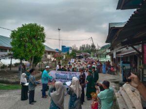 Air Mata Haru dan Gema Shalawat Warnai Pawai Ta’aruf Wisuda Tahfidz Angkatan III Masjid Al-Falah Siberut Utara